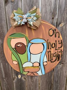 "This beautiful nativity door hanger will remind you and all who enter your home what the true meaning of Christmas is, Jesus. This design features a tan/brown distressed circle with the nativity scene of Mary, Joseph and baby Jesus and \"oh holy night\" with gold accents. This simple but beautiful door hanger will make a statement on your door this holiday season.  Check out my shop for the matching Christmas tree ornament!!   Coordinating ribbons of varying prints and colors will be used to cr Oh Holy Night, Christmas Yard Decorations, Christmas Jesus, True Meaning Of Christmas, Christmas Yard, Baby Jesus, Ribbon Design, Christmas Scene, Holy Night