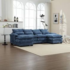 a large blue sectional sofa in a living room