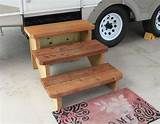 three step stools sitting in front of a truck