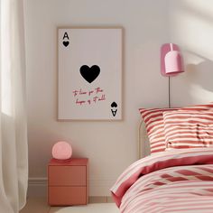 a bed room with a neatly made bed and a poster on the wall above it