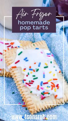 homemade pop tarts with white frosting and sprinkles on blue napkin