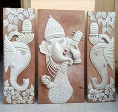 three decorative wall hangings with an elephant on one side and an elephant on the other