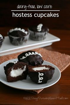 chocolate cupcakes with white frosting on a plate