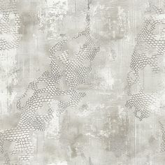 an old wallpaper with grey and white designs on it's surface, as well as grungy paint