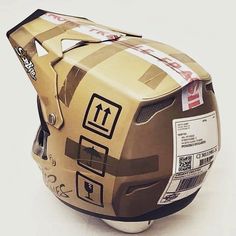 the helmet is made out of cardboard and has stickers on it