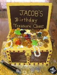 a birthday cake made to look like a chest with coins in it and the words jacob's birthday treasure chest