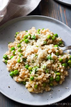 a white plate topped with rice and peas