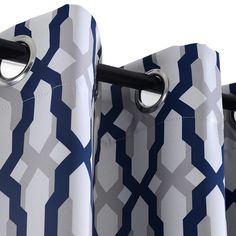 the blue and white curtains have rings on each side of them, with black handles