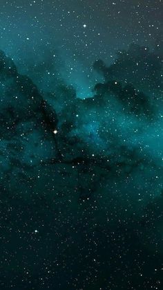 the night sky is filled with stars and dark clouds, as well as green hues