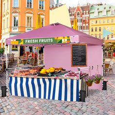 fresh fruits and vegetables are on display at an outdoor market