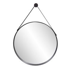 a round mirror hanging from a metal hook