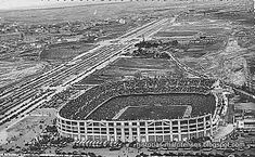 an aerial view of a stadium and train tracks