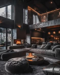 a living room filled with furniture and a fire place in the middle of it's walls