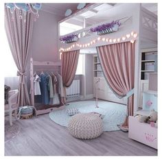 a bedroom with pink curtains and furniture in the room is decorated like a princess's castle