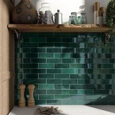 a green tile backsplash in a kitchen with wooden cabinets and shelves on the wall