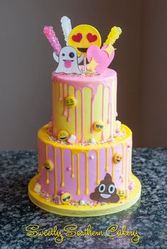 a three tiered cake with yellow and pink icing