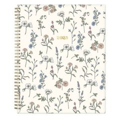 a spiral notebook with flowers on it