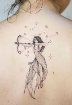 a woman with a bow and arrow tattoo on her back