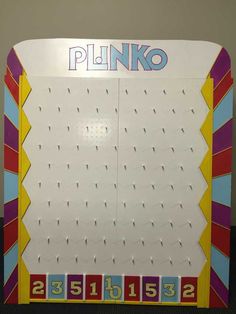 a sign that says pinko in front of a wall with numbers and letters on it