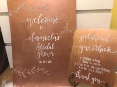 two wooden signs that say welcome to the bride and groom with handwritten names on them