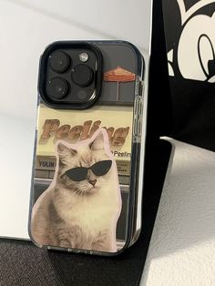 an iphone case with a photo of a cat wearing sunglasses on the front and back