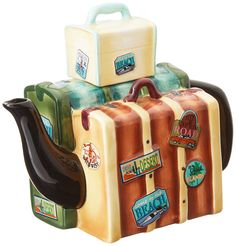 the toy suitcases are stacked on top of each other with luggage attached to them