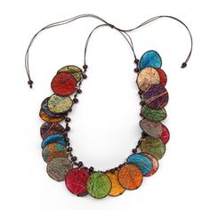 a multicolored necklace is shown on a white background, with beads hanging from it