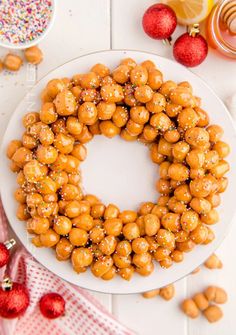 a white plate topped with a cake covered in nuts