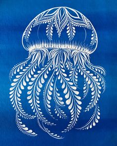 an intricately designed blue and white piece of art that looks like a jellyfish