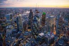 an aerial view of the city of london at dusk