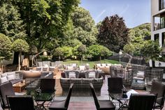 an outdoor seating area with tables and chairs