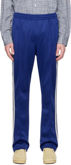 Polyester interlock jersey track pants. · Concealed drawstring at elasticized waistband · Three-pocket styling · Logo graphic embroidered at front · Pinched seam at legs · Striped knit trim at outseams Supplier color: Royal Needles Track Pants, Mens Activewear, Logo Graphic, Striped Knit, Track Pants, Apparel Accessories, Active Wear, Track, Trim