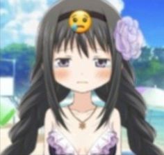 a girl with long black hair and a hat on her head is staring at the camera