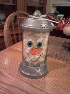 a frosty cup sitting on top of a wooden table