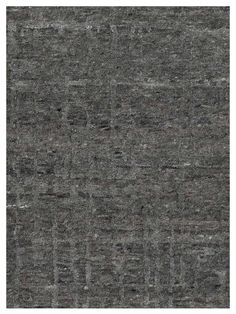 an area rug with grey and black colors