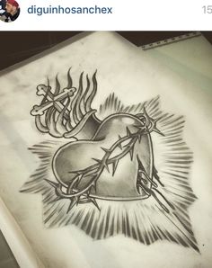 a drawing of a heart with barbed wire on it and an arrow in the middle