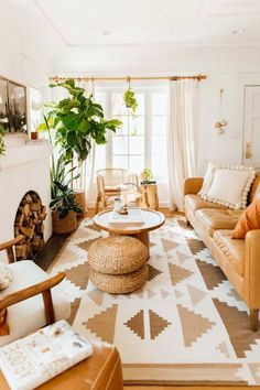 a living room filled with furniture and a fire place in the middle of a room