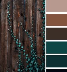 a wooden fence with green vines growing on it and the color scheme is brown, teal, and blue