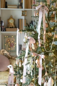 a christmas tree decorated with ornaments and ribbons