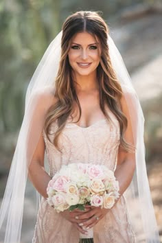 a woman in a wedding dress holding a bouquet