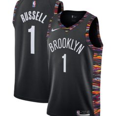 the brooklyn nets basketball jersey is black with white numbers and has a multicolored design on