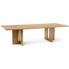 a wooden table sitting on top of a white floor