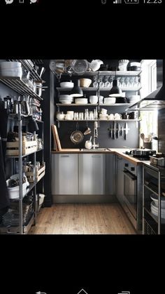 the kitchen is clean and ready to be used as a storage area for pots and pans