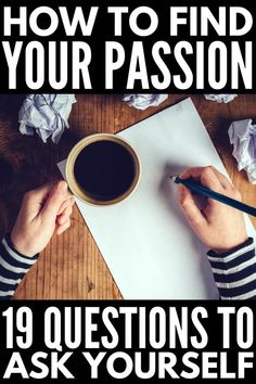 a person writing on top of a piece of paper next to a cup of coffee