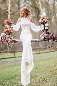 a woman in a white dress is holding flowers on a swing with the caption, unique lace top long sleeves mermaid long - length wedding dresses