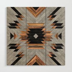 an art piece made out of wood with geometric designs on the top and bottom side