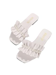 PRICES MAY VARY. Made of PU Leather and PVC material Open toe, wide band with ruffle trim and peals, casual sandals, outdoor flats The sandals go great with casual jeans, dress, romper, or another stylish outfit <b>Product Measurement:</b> <br><br>CN37: US: US6.5", Ball Girth: 8.4", Foot Length: 9.3", Heel Height: 0.4"<br><br>CN38: US: US7", Ball Girth: 8.6", Foot Length: 9.4", Heel Height: 0.4"<br><br>CN39: US: US7.5", Ball Girth: 8.7", Foot Length: 9.6", Heel Height: 0.4"<br><br>CN40: US: US8" Cheap White Jelly Slide Sandals, Cheap Cute White Flip Flops, Cute Beach Shoes Bow Slides White, Non-slip White Flat Jelly Sandals, Cheap White Non-slip Flip Flops, White Sandals, Kids Luggage, Casual Sandals, Wide Bands