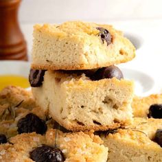 a stack of blueberry scones sitting on top of a white plate