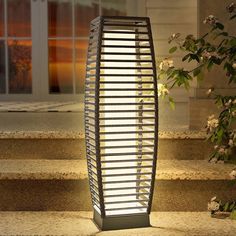 an outdoor light that is on some steps