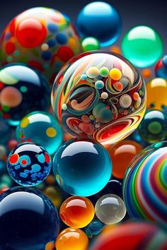 many different colored balls in the air with one being blown off by it's reflection